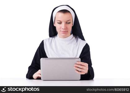 Nun working on laptop - religious concept