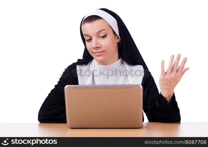 Nun working on laptop - religious concept