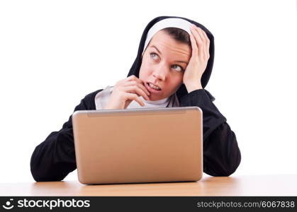 Nun working on laptop - religious concept