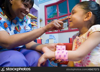 Nurse caring for girl