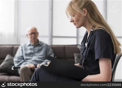 nurse consulting old man nursing home