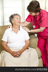 Nurse helps senior woman. Could either be in-home care or at a nursing home or assisted living facility.