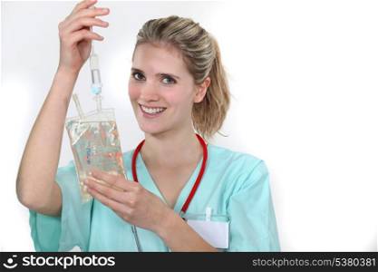 Nurse hooking up an IV