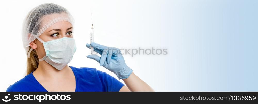 Nurse in a mask with a syringe for injection on white background with copy space