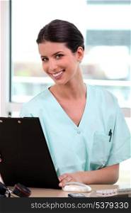 Nurse in front of computer