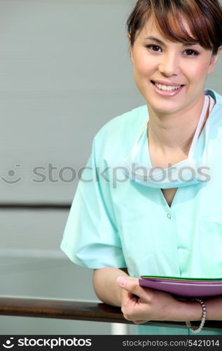 Nurse leaning against railing