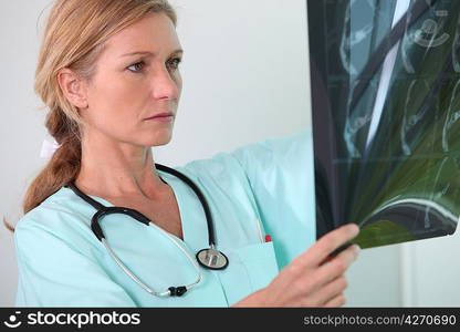 Nurse looking at X-ray