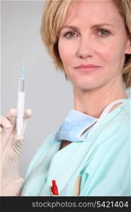 nurse preparing an injection