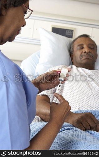 Nurse Preparing To Give Senior Male Patient Injection