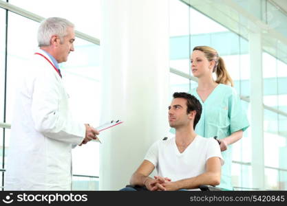 Nurse pushing patient in wheelchair