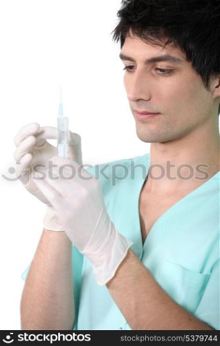 Nurse putting on gloves.