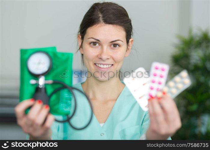 nurse showing pills to camera
