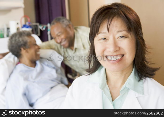 Nurse Smiling In Hospital Room