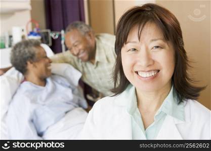 Nurse Smiling In Hospital Room