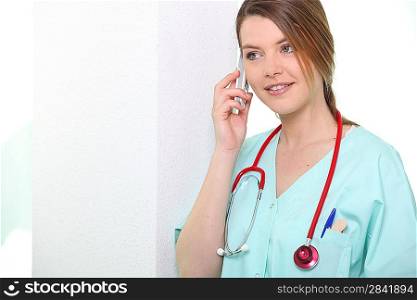 Nurse smiling on phone