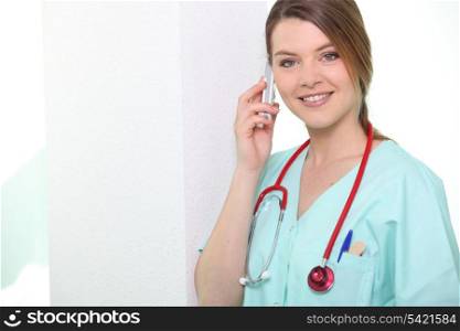 Nurse smiling on phone