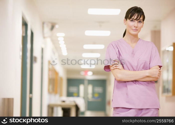 Nurse Standing In A Hospital Corridor