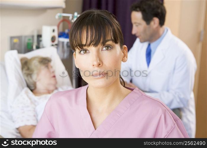 Nurse Standing In Hospital Room,Doctor Talking To Patient
