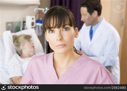 Nurse Standing In Hospital Room,Doctor Talking To Patient