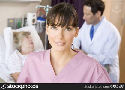 Nurse Standing In Hospital Room,Doctor Talking With Patient