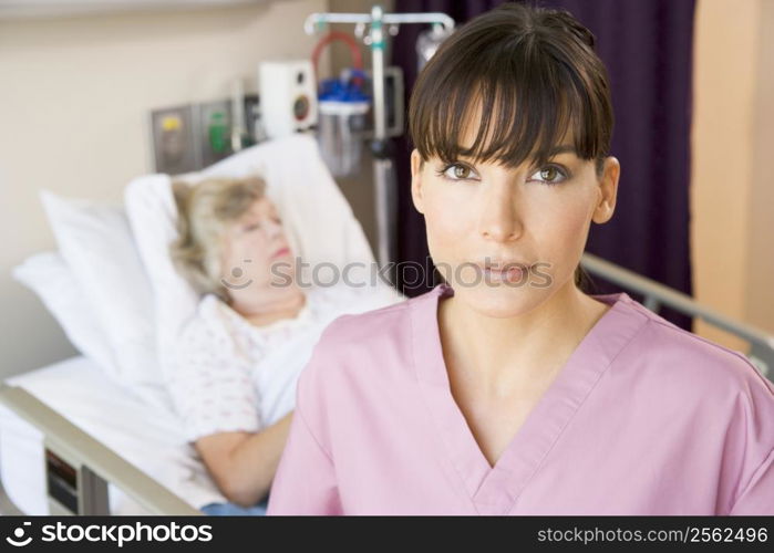 Nurse Standing In Patients Room