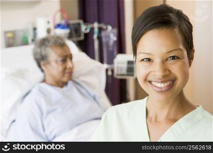 Nurse Standing In Patients Room