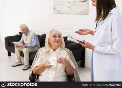 nurse talking old woman