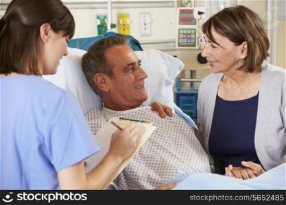 Nurse Talking To Couple On Ward
