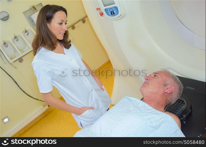 Nurse talking to patient waiting to have scan