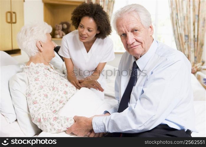Nurse Talking To Senior Couple