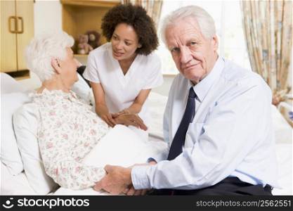 Nurse Talking To Senior Couple