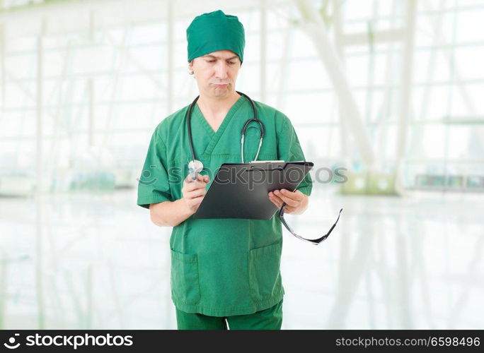 nurse thinking with his notes, at the hospital