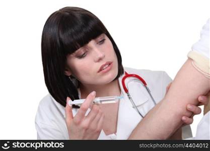 Nurse vaccinating patient