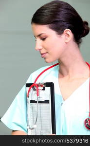 Nurse with a clipboard and stethoscope