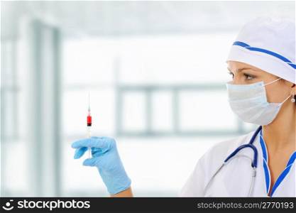 nurse with a syringe in his hand. Isolated on white background
