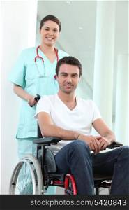 Nurse with disabled man in a wheelchair