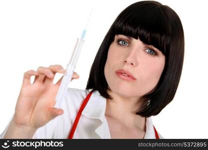 nurse with helmet haircut holding syringe