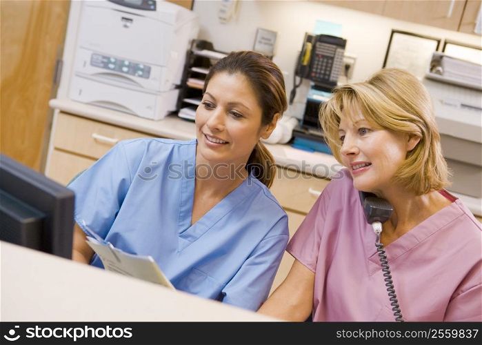 Nurses At The Reception Area In A Hospital