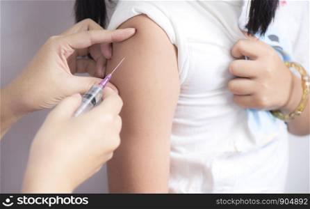 Nurses' hands are preparing injections vaccination for child patient
