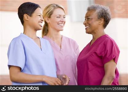 Nurses Standing Outside A Hospital