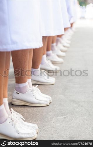 Nursing shoes standing in a row. Lined neatly.