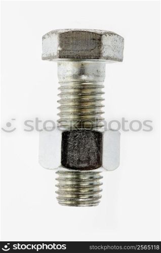 Nut and bolt against white background.