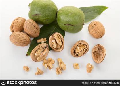Nut and chopped walnut. Close up. Juglans regia