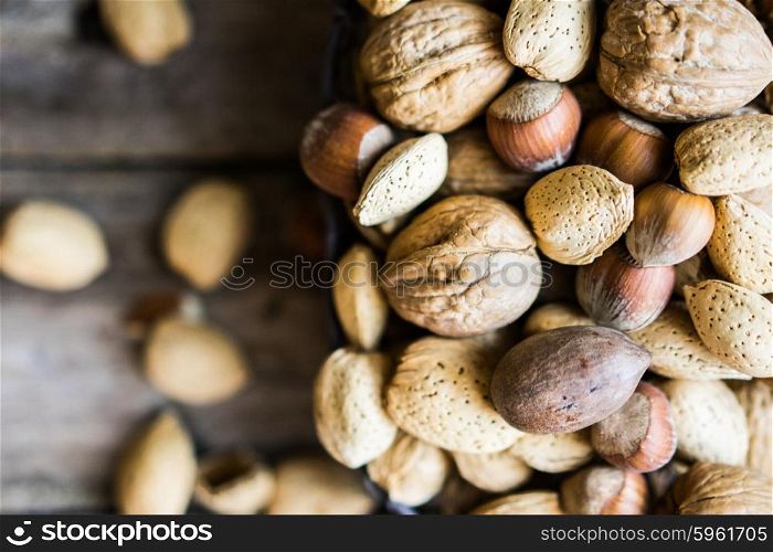 Nut mix on rustic wooden background