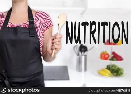 nutrition cook holding wooden spoon concept background. nutrition cook holding wooden spoon concept background.