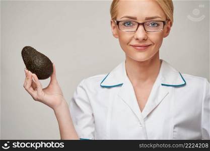 nutritionist doctor healthy lifestyle concept - holding organic avocado fruit.. nutritionist doctor healthy lifestyle concept - holding organic avocado fruit
