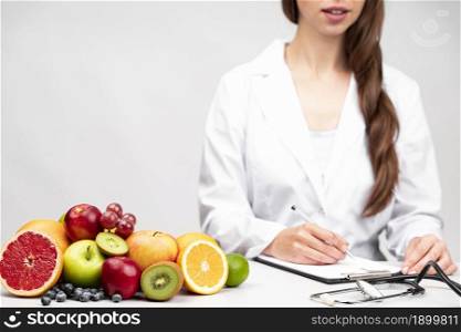 nutritionist having healthy fruit snack. Resolution and high quality beautiful photo. nutritionist having healthy fruit snack. High quality beautiful photo concept