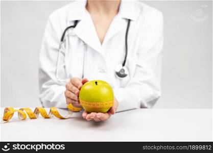 nutritionist woman holding apple. Resolution and high quality beautiful photo. nutritionist woman holding apple. High quality beautiful photo concept
