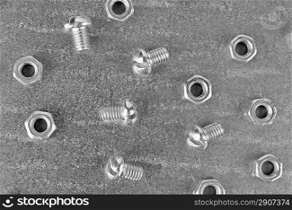 nuts and screws on the metal plate