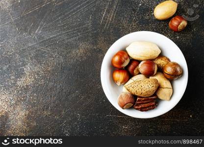 nuts in bowl, mix nuts in white bowl